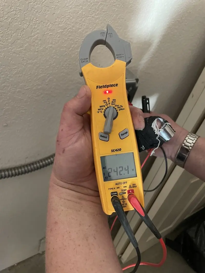 Voltage testing with clamp meter during Electrical Installation Services in Battle Creek
